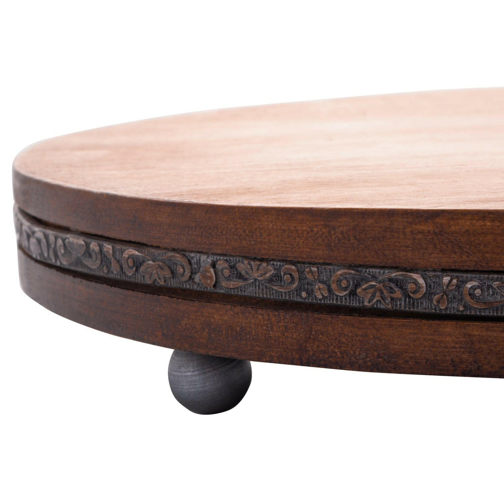 Wooden round table with decorative edge and black leg 